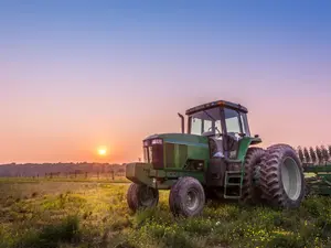 What do you call a tractor that gets paid for what it does?