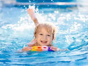 What does a toddler wear while swimming on summer vacation?