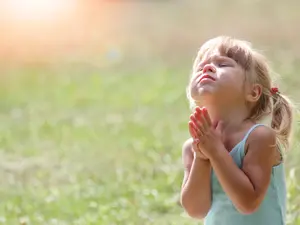 Why did the children think that prayer meant they would get more toys?