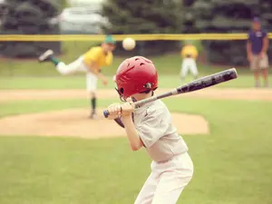 Why did the Little League® player run to the park during his time at bat?