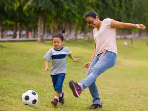 Why did the mom decide to play soccer in her spare time?
