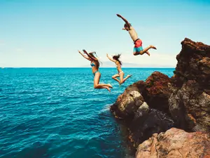 Why did the teacher jump into the ocean?